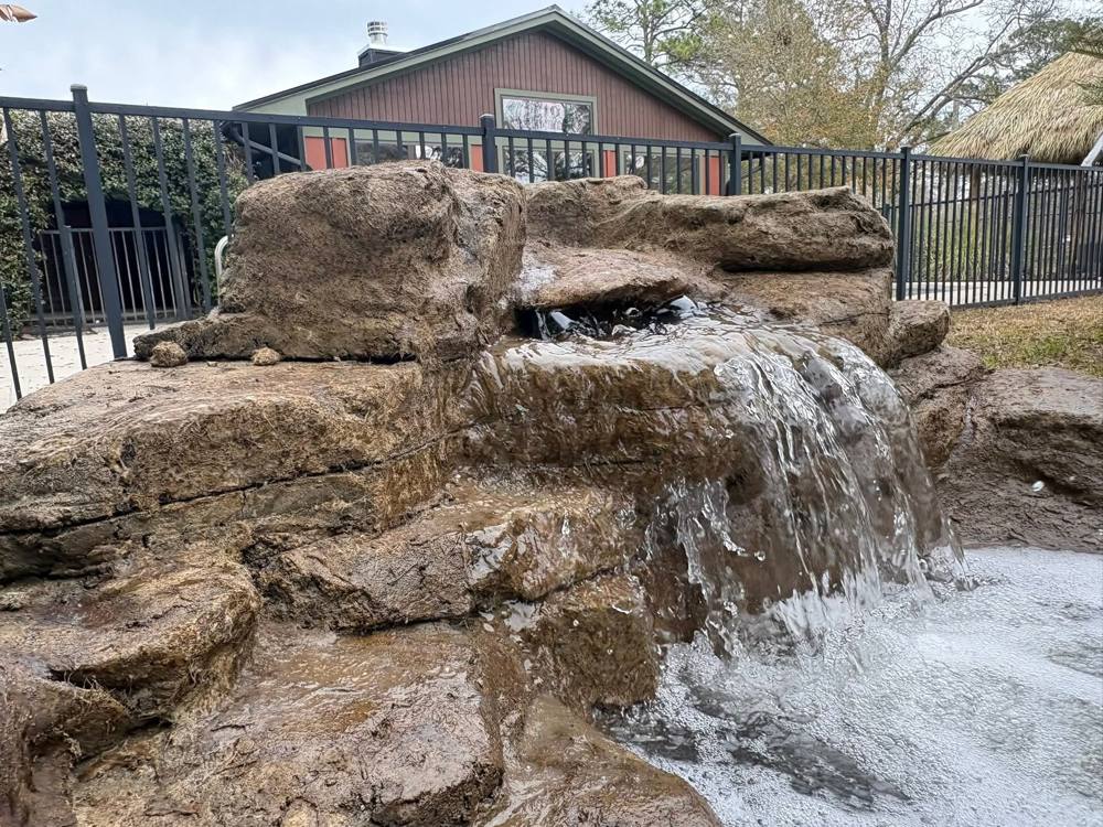 Sculpted faux rock formation with a waterfall
